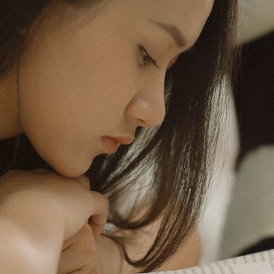 A calm, focused face of a person during meditation.